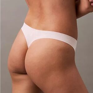 NWT Calvin Klein Invisible Micro Thong Size Large Nymphs Thigh Pink